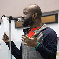 A student speaks using a mic.