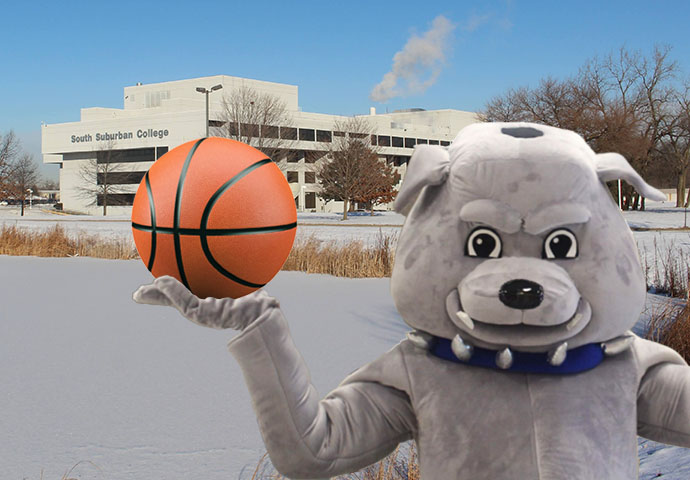 Bruno mascot holding a basketball in front of the Main Campus in winter.