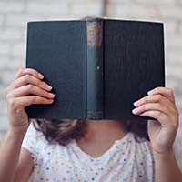 Hands with book.