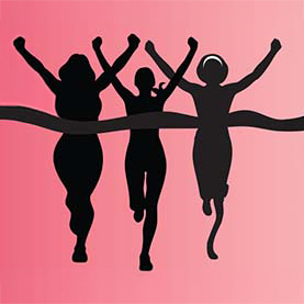 Silhouette of women running through a finish line.